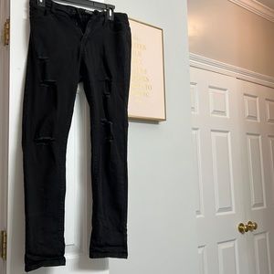 Black distressed jeans.